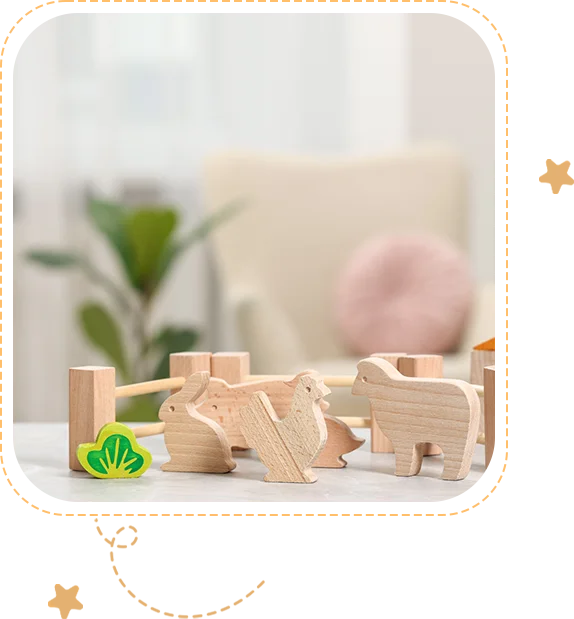 A wooden toy set of animals and blocks.