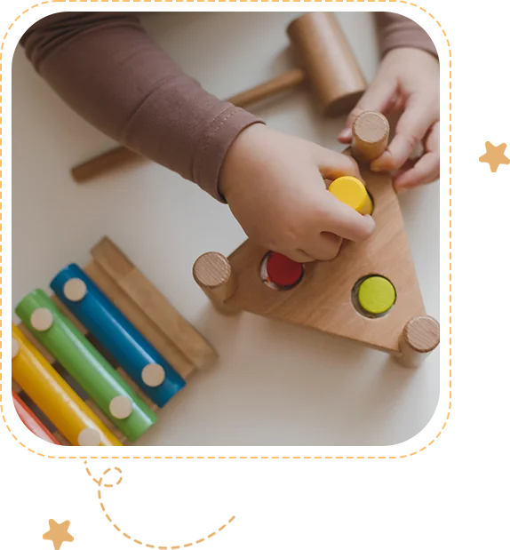 A child playing with wooden toys on the table.