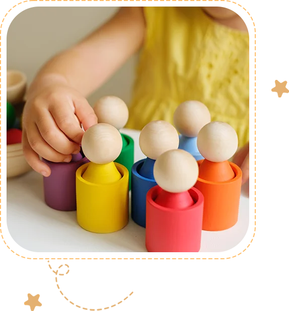 A child playing with wooden toys on the table.