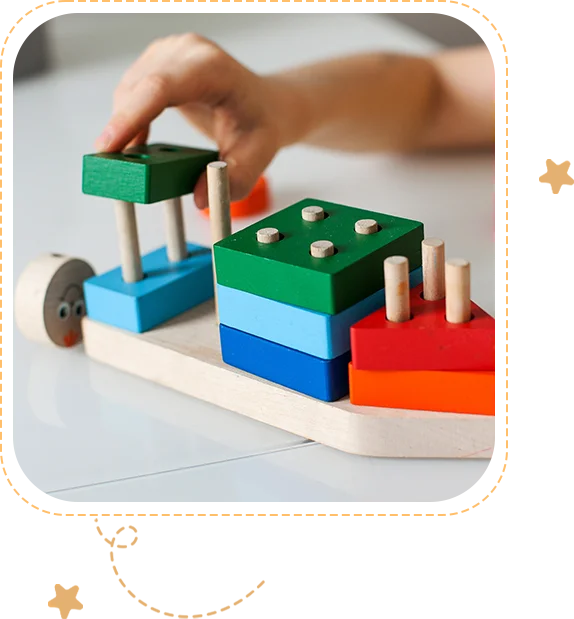 A child playing with wooden blocks on a table.