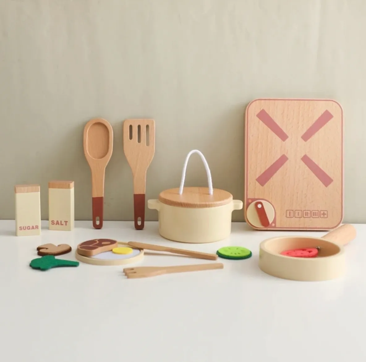 A table with wooden utensils and other items.