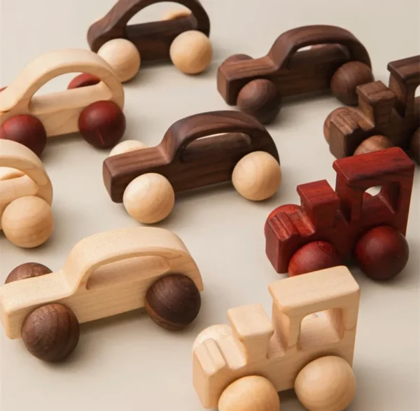 A group of wooden toy cars and trucks.