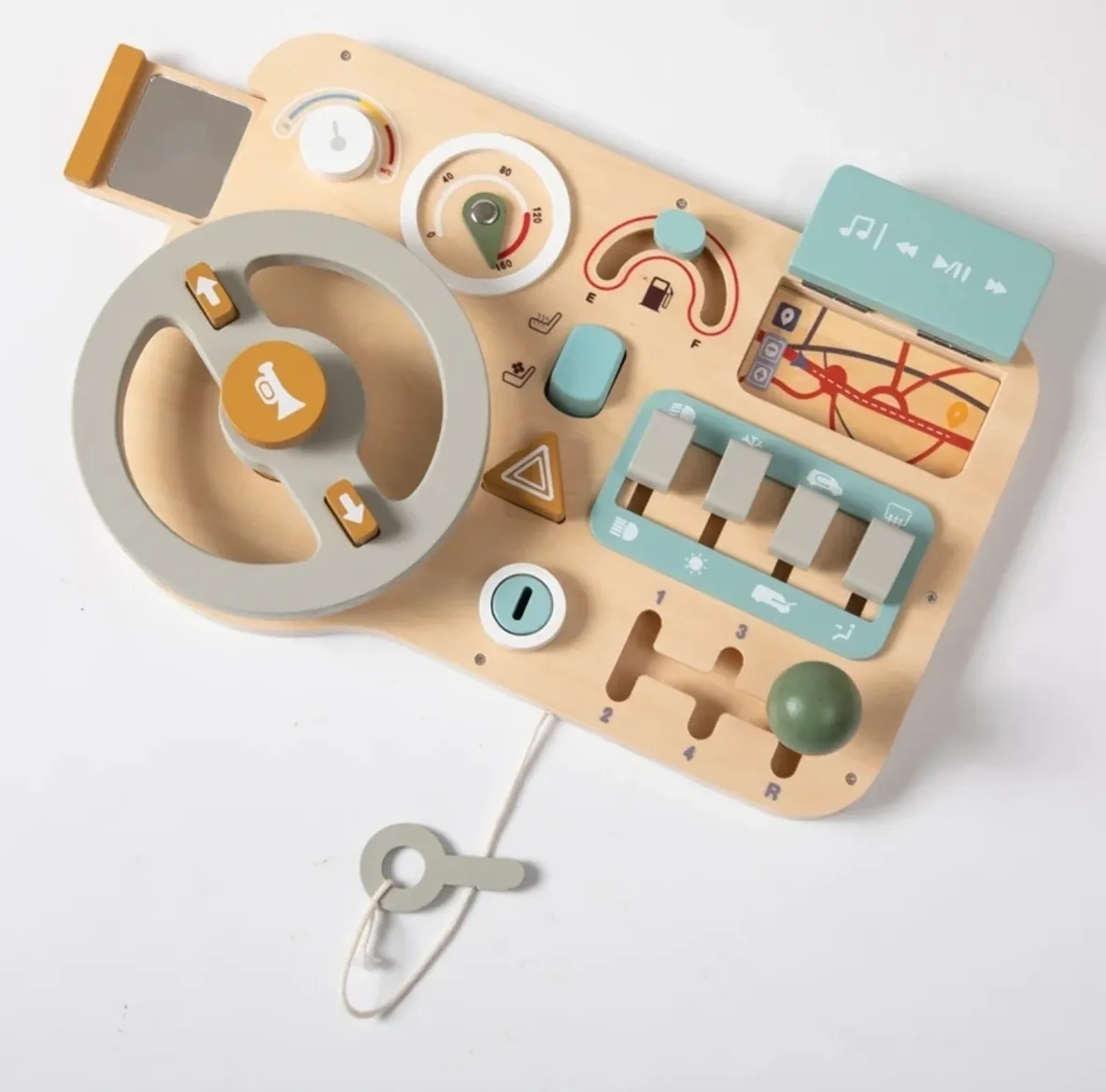 A wooden toy steering wheel with various objects.