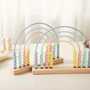A set of four wooden abacus toys on top of a table.