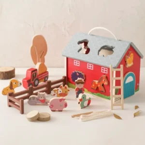 A wooden toy set of a barn and farm.