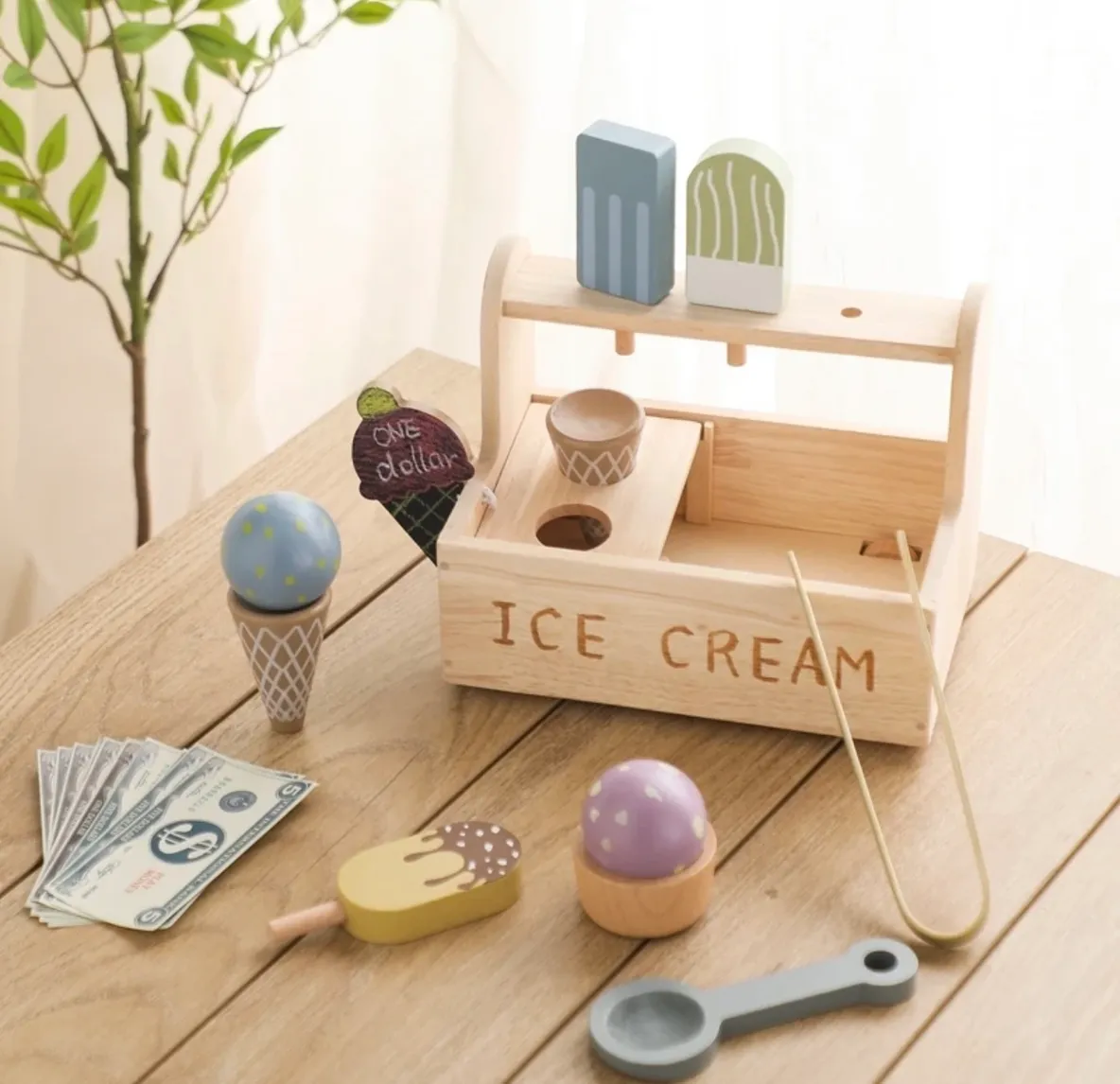 A wooden ice cream set on top of a table.