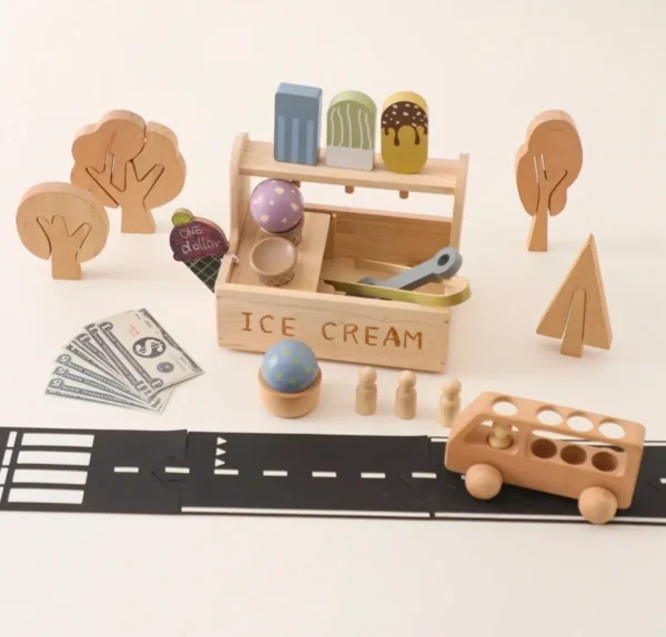 A wooden toy set with trees, ice cream and other items.