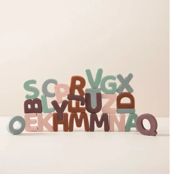 A pile of wooden letters sitting on top of each other.