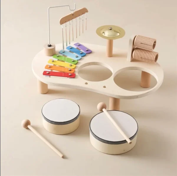 A wooden toy set of drums and sticks.