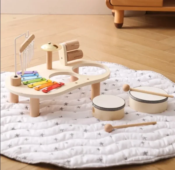 A wooden toy set is sitting on the floor.