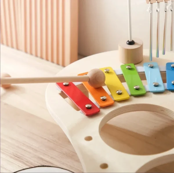 A wooden xylophone with many colored keys.