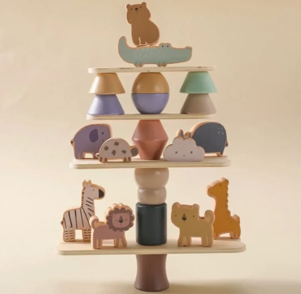 A wooden toy tree with animals on it.