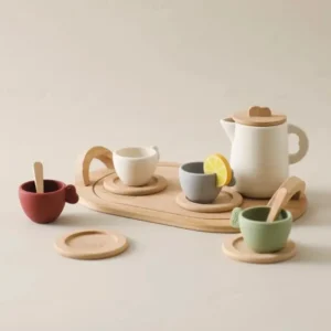 A wooden tray with cups and saucers on it.