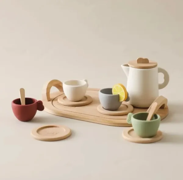 A wooden tray with cups and saucers on it.