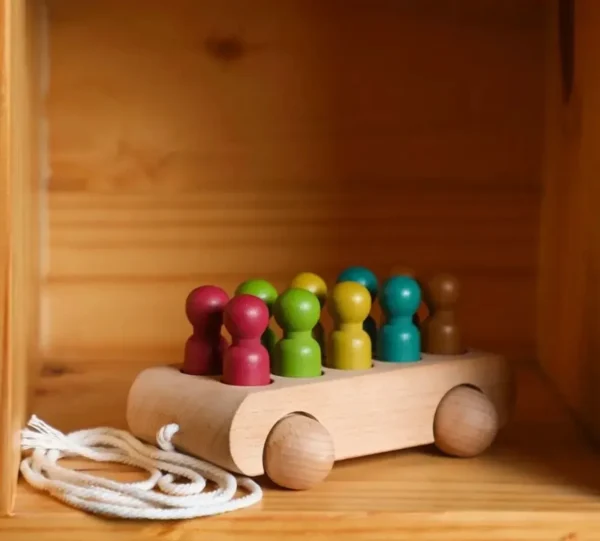 A wooden toy car with colorful wooden knobs.