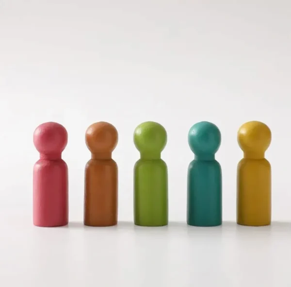 A group of colorful wooden people sitting in a row.