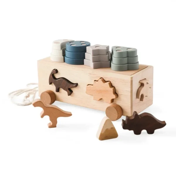 A wooden box with some wood toys on it