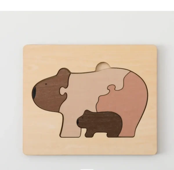 A wooden puzzle of a bear and its cub.