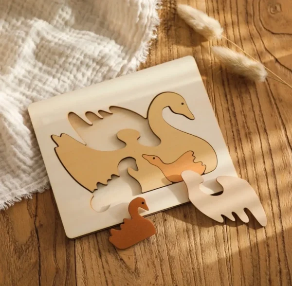 A wooden puzzle with an animal on it.