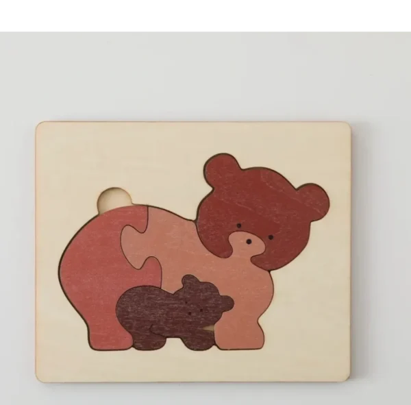 A wooden bear puzzle with the picture of a baby bear.