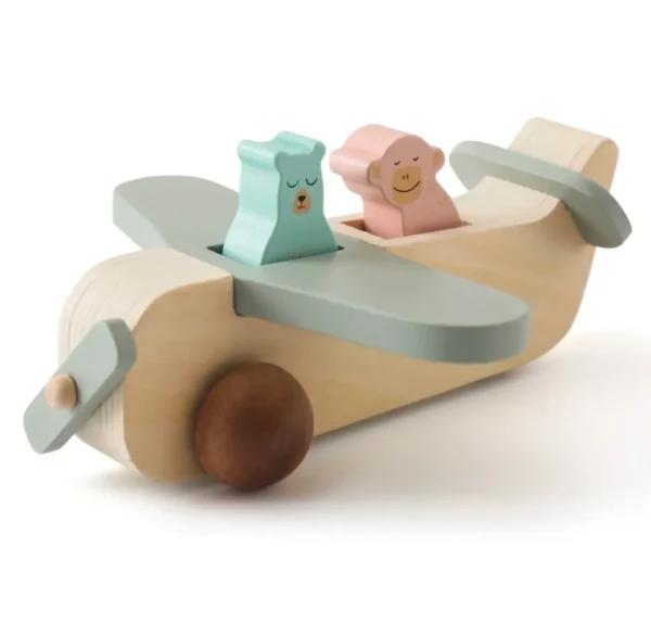 A wooden toy plane with two different colored wheels.