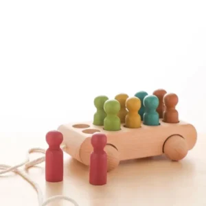 A wooden toy with people on it