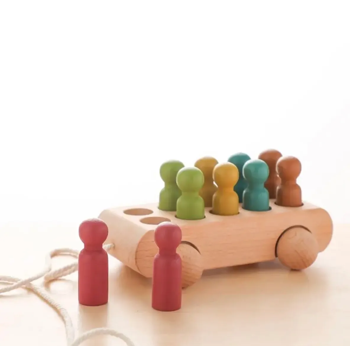 A wooden toy with people on it