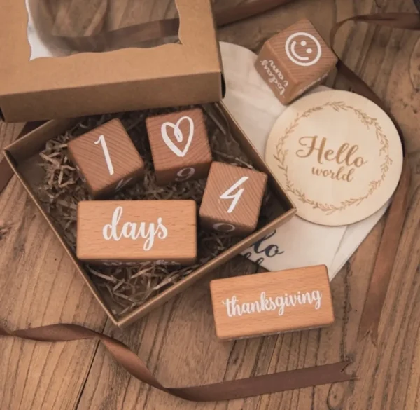 A box with wooden blocks that say " hello world ".