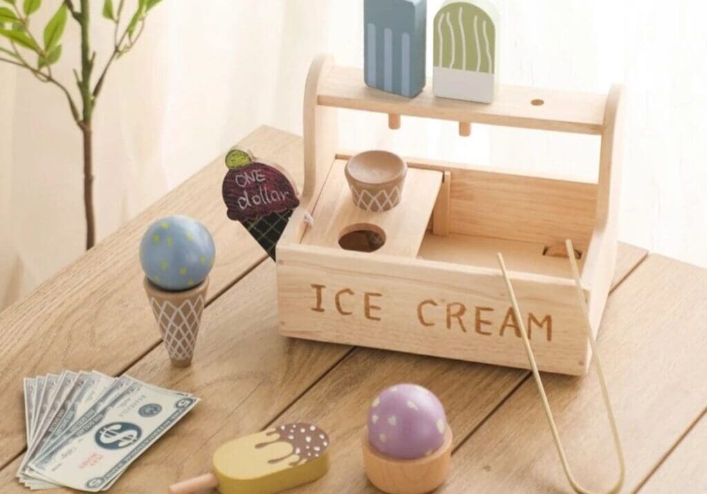 A wooden ice cream set on top of a table.